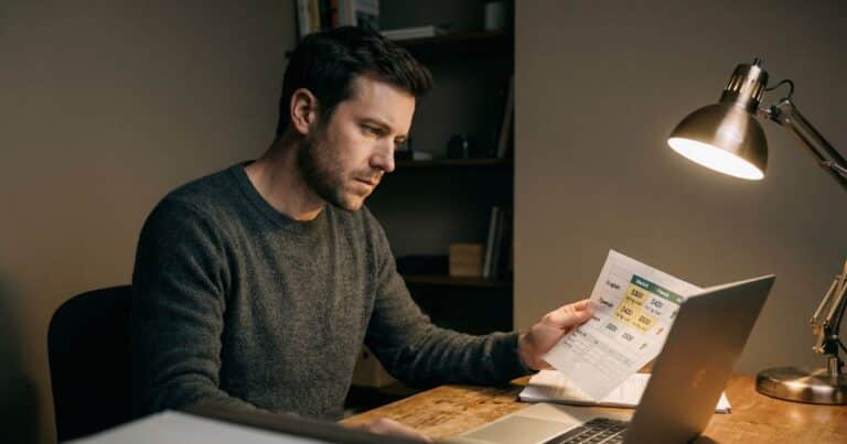 SEOWriting AI review scene showing content strategist analyzing multilingual translation costs at desk