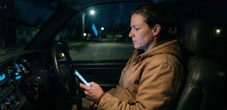 Local seo ranking issue roofing business owner in truck at night checking phone with low visibility results